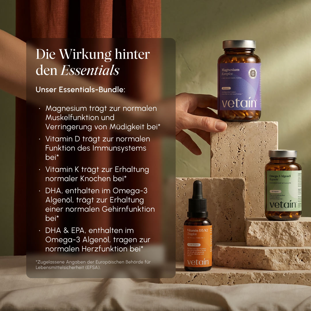 Lifestyle photo with Vetain products on stone pedestals. Text overlay "The effect behind the essentials": Magnesium for muscle function & less fatigue, Vitamin D for the immune system, Vitamin K for bones, DHA & EPA from omega-3 algae oil for brain and heart function (EFSA-approved claims)