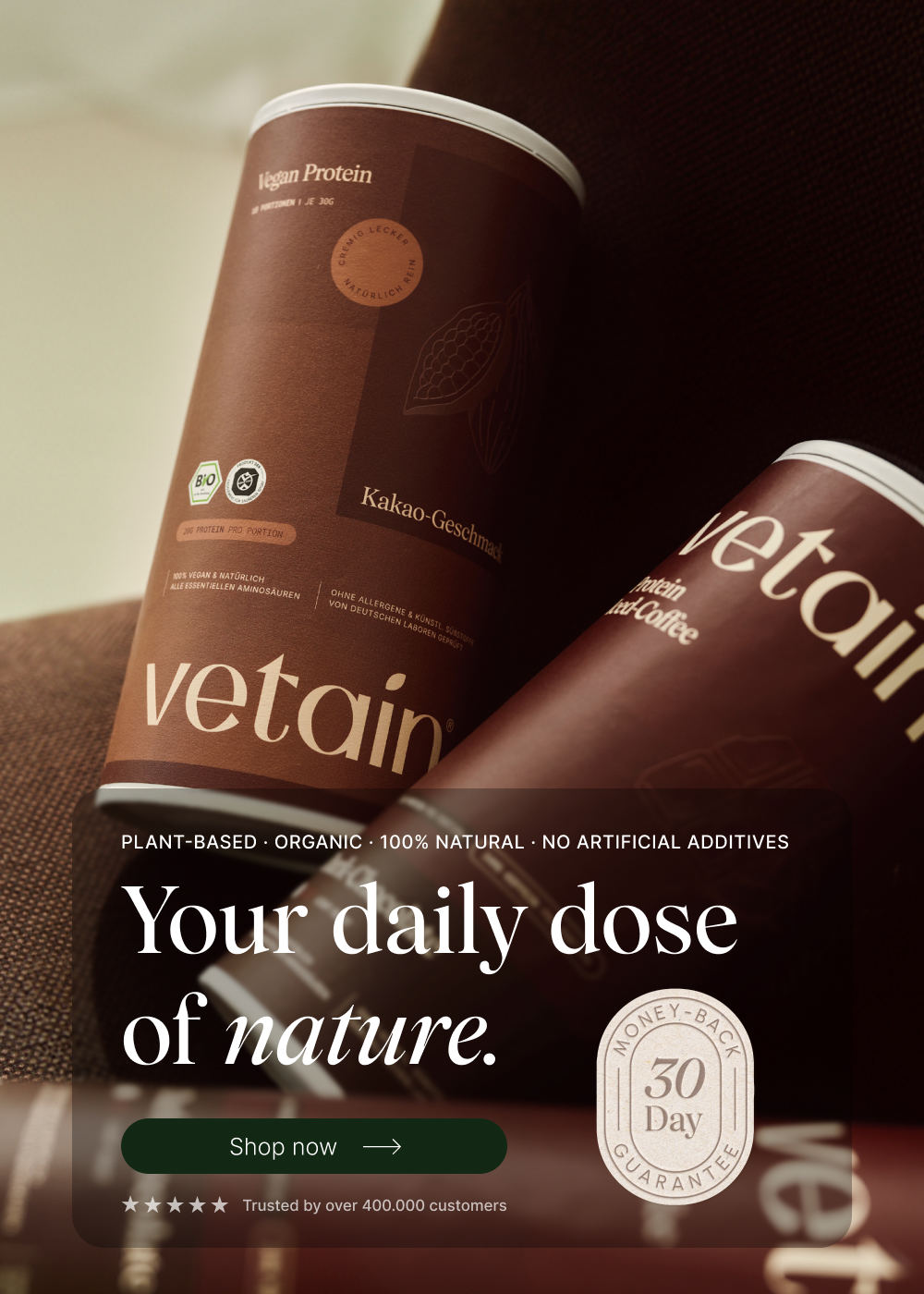 Vetain Vegan Protein hero banner (portrait) with two tubs (cocoa and iced-coffee flavour). Headline "Your daily dose of nature." with "Shop now" button and 30-day money-back seal.