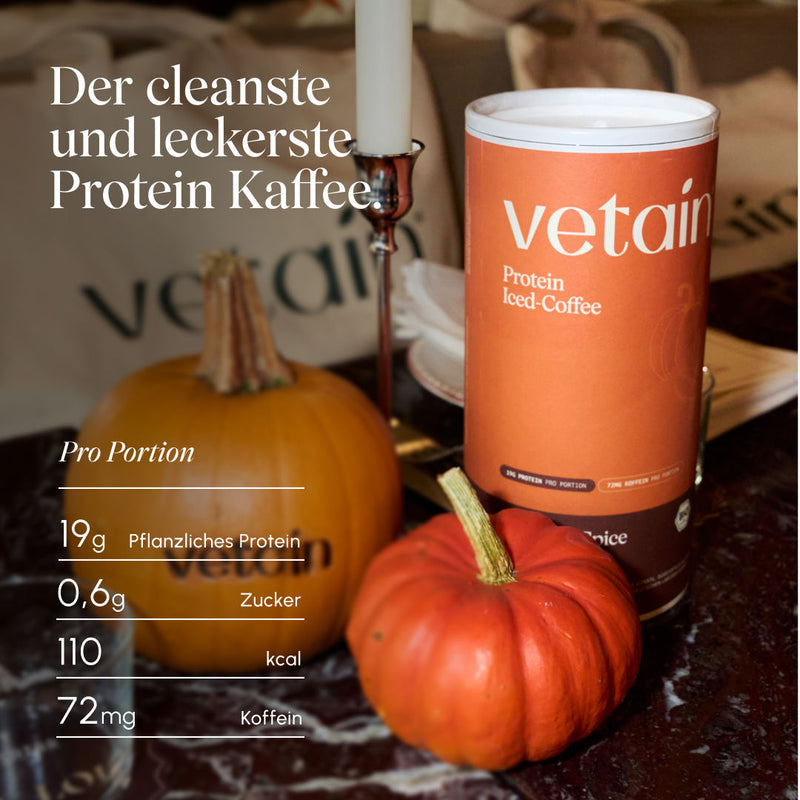 Vetain Protein Iced Coffee Pumpkin Spice can on a table with pumpkins and a candle. Headline “The cleanest and most delicious protein coffee.” Nutritional values per serving: 19 g plant-based protein, 0.6 g sugar, 110 kcal, 72 mg caffeine.
