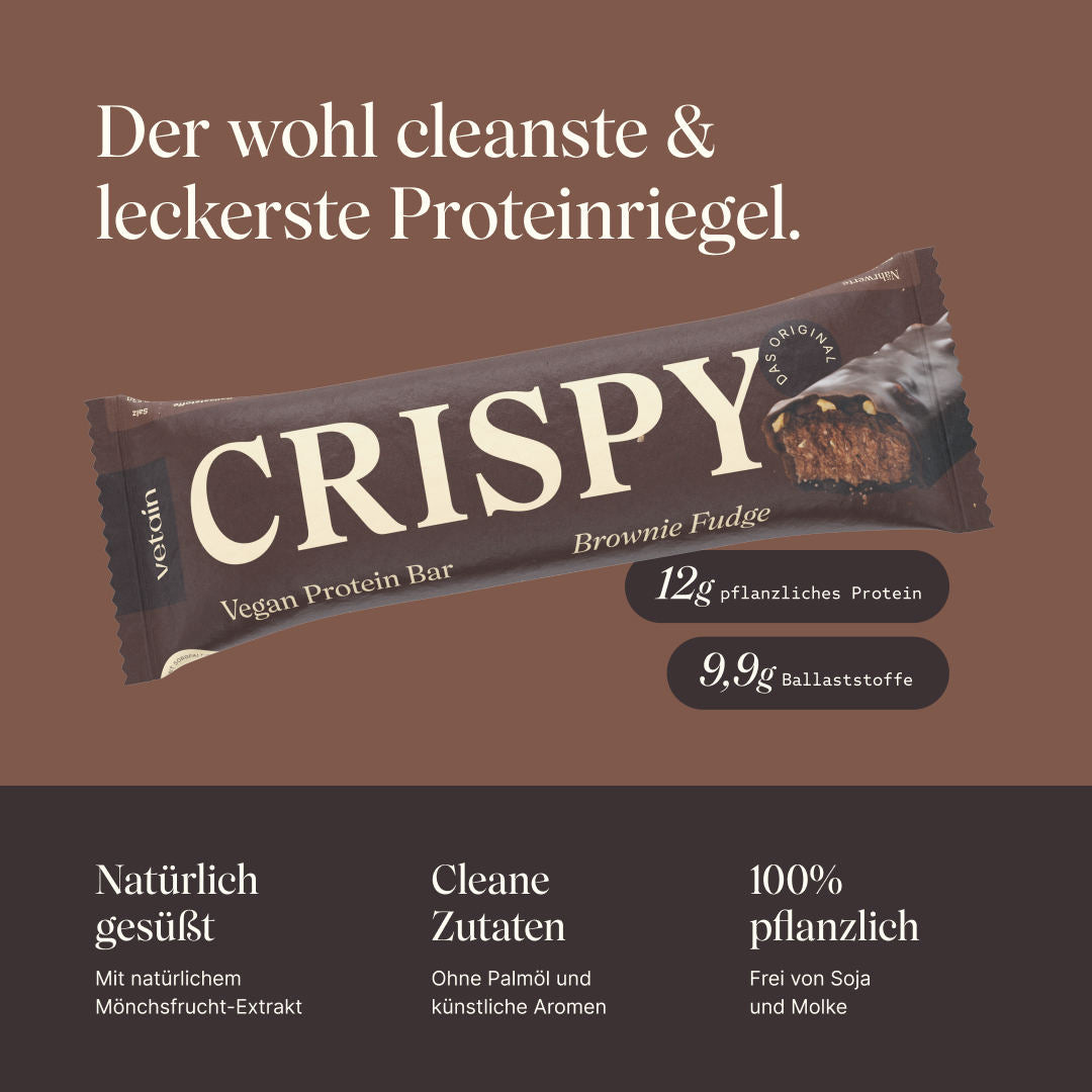 Vetain Crispy Proteinriegel Brownie Fudge. Der wohl cleanste & leckerste Proteinriegel. 12g pflanzliches Protein, 9,9g Ballaststoffe. Natürlich gesüßt mit natürlichem Mönchsfrucht-Exkrakt, cleane Zutaten ohne Palmöl und künstliche Aromen, 100% pflanzlich und frei von Soja und Molke